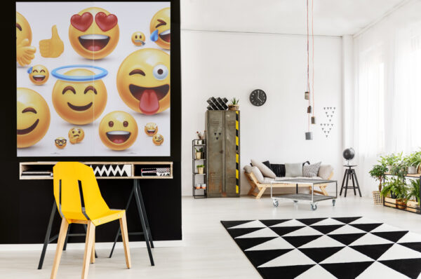 Yellow designer chair at desk with computer monitor in spacious living room interior with workspace